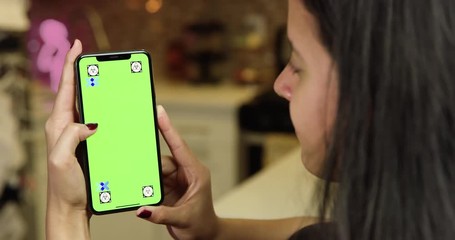 woman using green screen phone