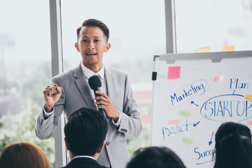 Businessman is explaining works to officers while training together at the office.