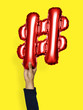 © Rawpixel.com - Hand holding balloon hashtag symbol #