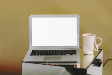 Wall Mural - blank laptop screen and a pink coffee cup