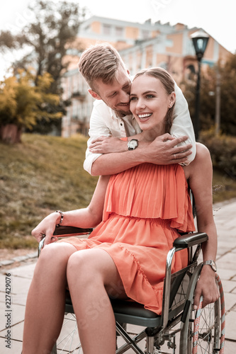 Kind Hug Kind Loving Man Standing Behind The Back Of His Disabled Girlfriend And Hugging Her Stock Photo Adobe Stock Kind Hug Kind Loving Man Standing Behind The Back Of His Disabled Girlfriend And Hugging Her Stock Photo Adobe Stock