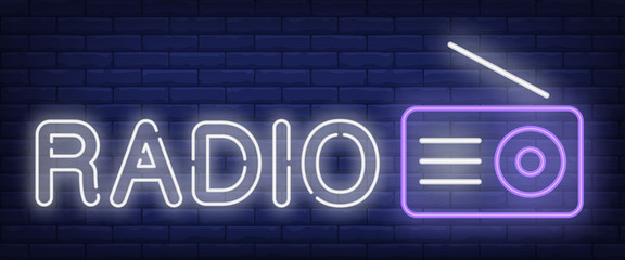 Wall Mural - Radio neon sign. Receiver with antenna on brick wall background. Vector illustration in neon style for radio station and broadcasting