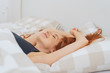 © contrastwerkstatt - Young pretty woman relaxing in bed