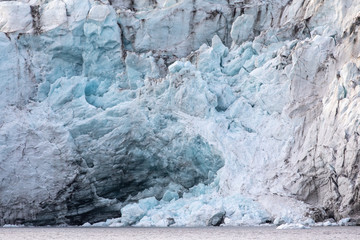 Wall Mural - isfjorden glacier front of blue ice in svalbard on a summer day.