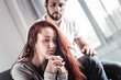 © Viacheslav Yakobchuk - So sad. Cheerless unhappy young woman sitting together with her boyfriend and holding her hands together while focusing on her problems