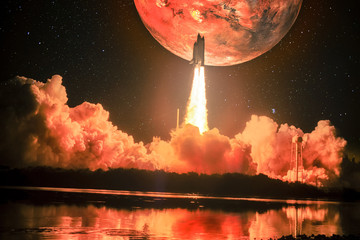 Wall Mural - lighting up the night sky, as well as the water nearby, spacship blazes into the mars mission. huge 