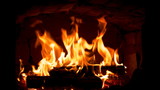 Fototapeta Storczyk - Firewood and fire flames in fireplace