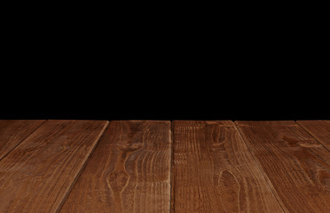 Wall Mural - Empty wooden table perspective view on black background with clipping path