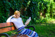 Literary critic. Lady pretty bookworm busy read book outdoors sunny day. Woman concentrated reading book in garden. Girl sit bench read book nature background. Woman prepare review about bestseller