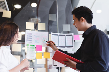 Wall Mural - creative designer team hands sketching of screens for mobile responsive website development with ui/