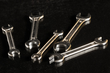 A set of spanners against black background