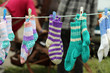 hand nitted socks hanging on clothes line, Newfoundland, Canada