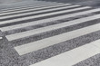road surface marking and traffic concept - close up of crosswalk
