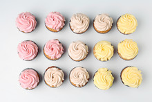 Delicious Cupcakes On White Background, Flat Lay
