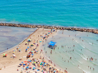 Wall Mural - Beautiful beach and sunbathers and the mediterranean sea in Alicante. Spain.