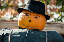 Portrait Of Halloween Scarecrow With Pumpkin Head