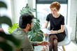 © alfa27 - psychotherapist consulting man, asking questions, interviewing man sitting on sofa. psychologist with client