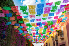 Colorful Paper Flags Over Street
