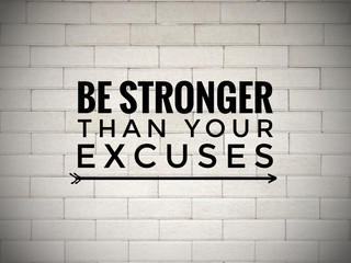 Wall Mural - Motivational and inspirational quote - ‘Be stronger than your excuses’ written on white blurred wall background.
