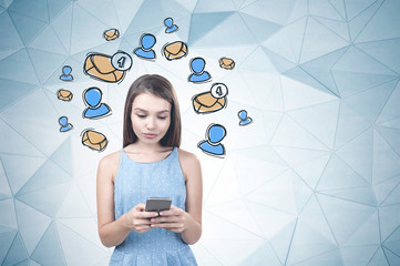 Young girl with smartphone, email icons