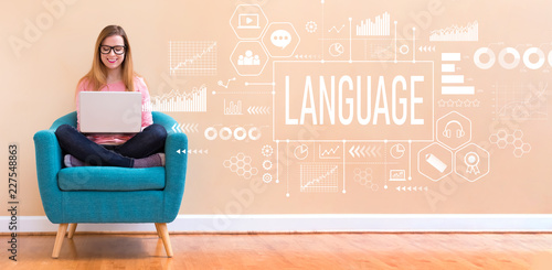 Photographie Language with young woman using her laptop in a chair