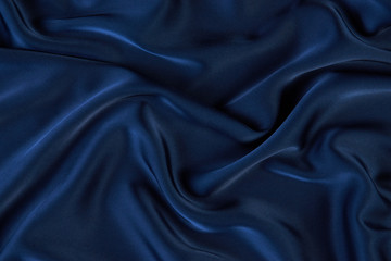 dark blue silk fabric background, view from above. smooth elegant blue silk or satin luxury cloth te
