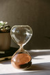 © HelenRushbrook/Stocksy - A sand timer through which all of the sand has run, indicating that time is up.