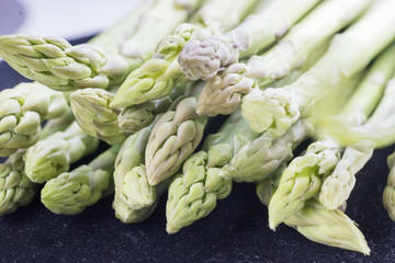 Green sprouts of fresh raw asparagus