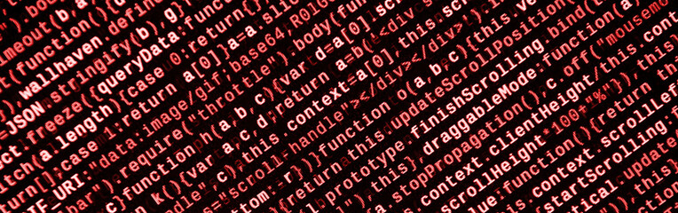 Writing programming code on laptop. Digital binary data on computer screen