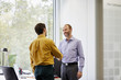 © altoimages/Stocksy - Advisor Shaking Hands With Customer In Office