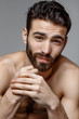 © leandrocrespi/Stocksy - Handsome young man beauty session.