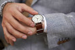 © Pelle/Stocksy - Stylish man checking the time on his watch