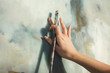 © awsmsky/Stocksy - Close up of an artist's hand with brush