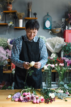 Floral Shop Owner Working In The Flower Shop