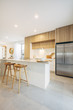 © imagesupply/Stocksy - Open plan kitchen and living room inside modern home