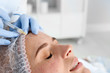 © New Africa - Woman undergoing face biorevitalization procedure in salon, closeup. Cosmetic treatment