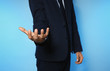 © New Africa - Businessman holding something on color background, closeup of hands