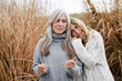 © Bonninstudio/Stocksy - Portrait of two women in a field