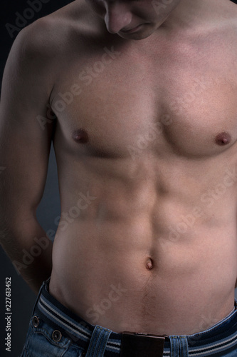 photo Men With Light Abs https stock adobe com images muscular torso of a young handsome man athlete s chest flatter press abs biceps sportsman hands back studio light low key black background close up 227613452 start checkout 1 content id 227613452