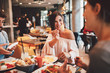 © djile - Group of Happy friends having breakfast in the restaurant