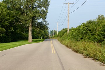 A long empty highway road in the country.