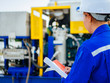 © phuangphech - Engineer woman in industry factory checking production.