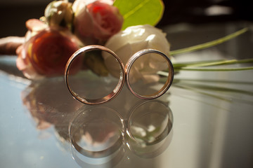 Wall Mural - The reflection of two wedding rings in the glass