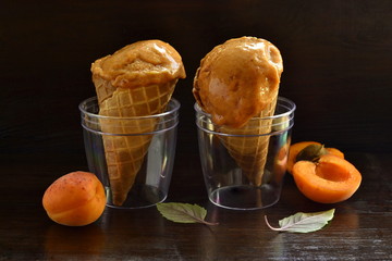 Wall Mural - Apricot ice cream in waffle cones. Vegan.