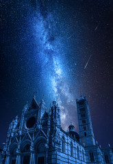 Wall Mural - siena cathedral at night with falling stars, tuscany, italy