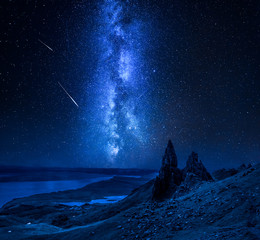 Wall Mural - Milky way, falling stars over Old Man of Storr, Scotland