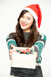 Young asian woman feeling happy on Christmas day with Santa hat and gift box in hand white background
