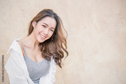 Portrait Of Young Beautiful Asian Woman Sit And Relax Over