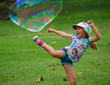 © Michelle - Little Girl Kicking a Giant Bubble