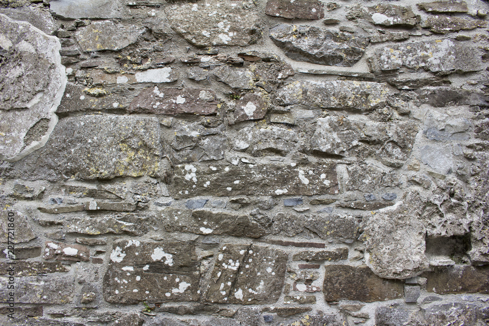 Medieval Rocks Color Medieval gray color stone wall background with aged appearance and ...
